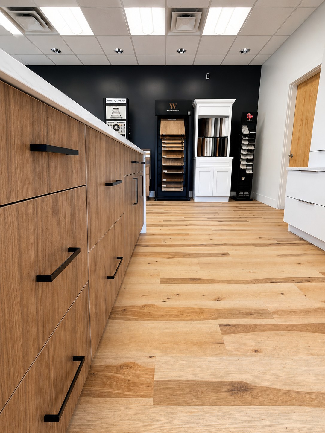 Display cabinet run with wood fronts in the showroom